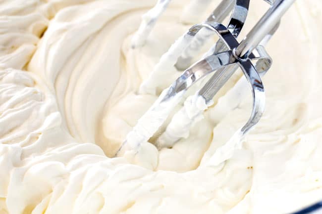 showing how to make Chocolate Eclair Cake by making homemade whipped cream