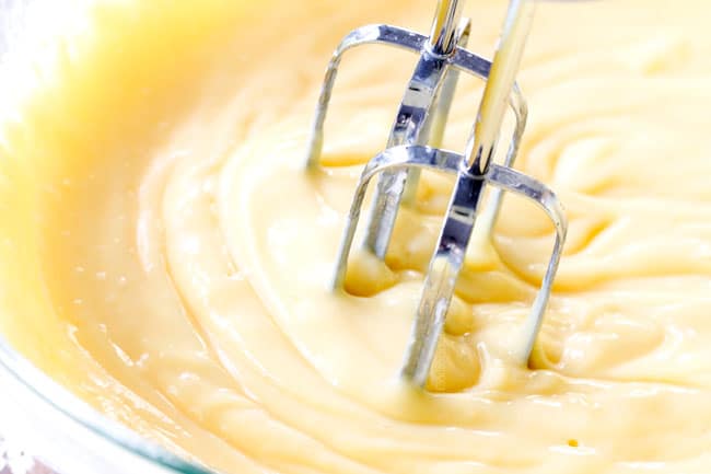 showing how to make Chocolate Eclair Cake by whipping vanilla pudding together in a glass bowl