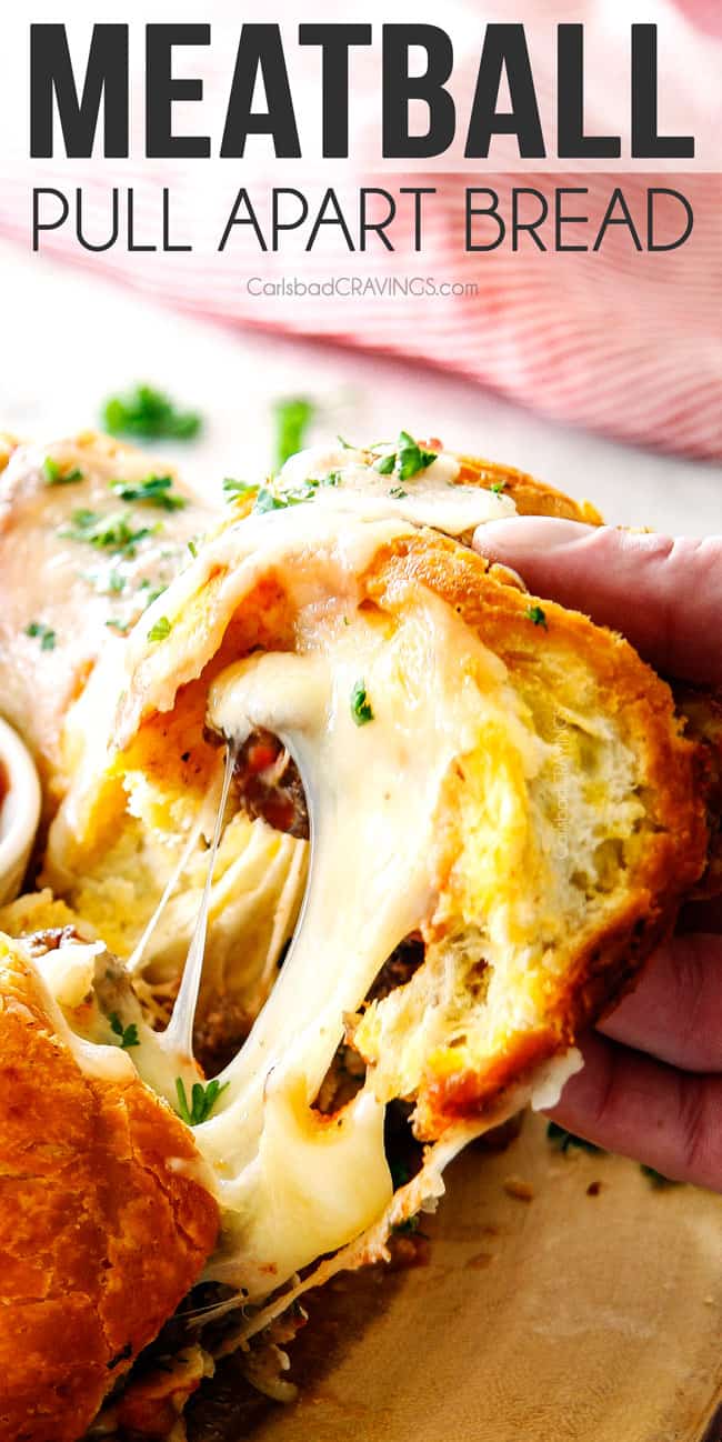 stringy cheese shot of garlic pull apart bread being pulled away