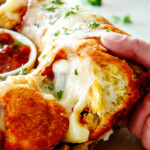 side shot of cheesy pull apart bread being pulled