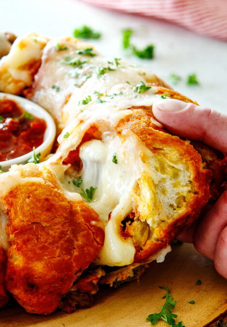 side shot of cheesy pull apart bread being pulled
