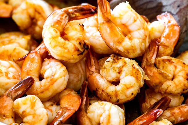 showing how to make laksa by sauteeing shrimp