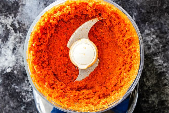 showing how to make laksa paste by blending all of the ingredients together into a paste