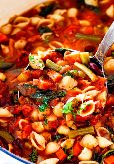 up close of a ladle full of Italian Minestrone Soup with pasta