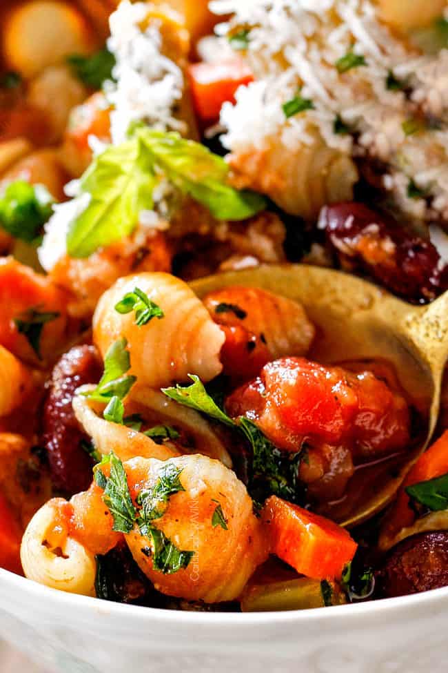 up close of a spoonful of best Italian Minestrone Soup Recipe with pasta, tomatoes, and beans