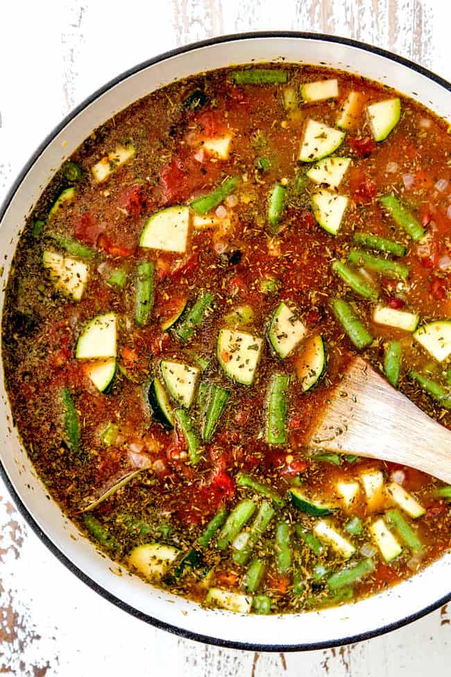 showing how to make authentic Minestrone Soup Recipe by simmering vegetables, tomatoes and beans together 