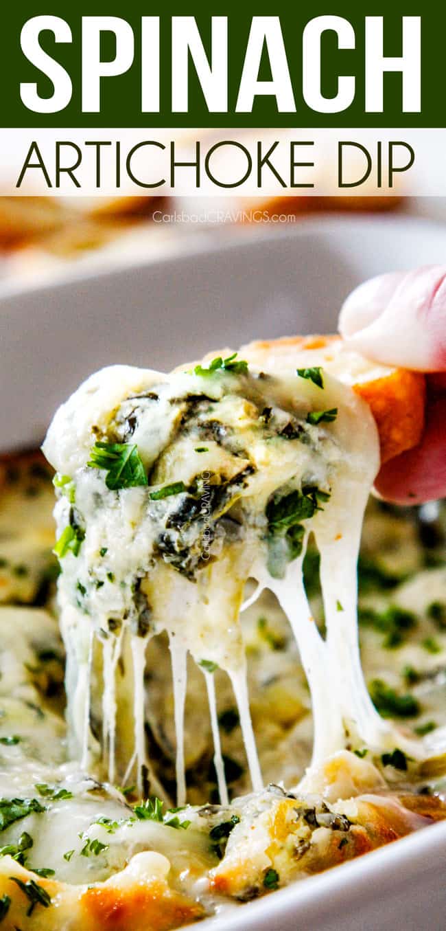 up close of bread being pulled from cheesy hot spinach artichoke dip