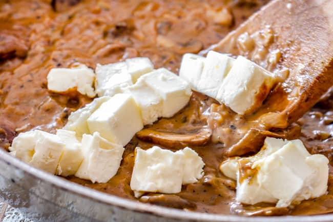 showing how to make Chicken Stroganoff by adding cream cheese to Stroganoff Sauce