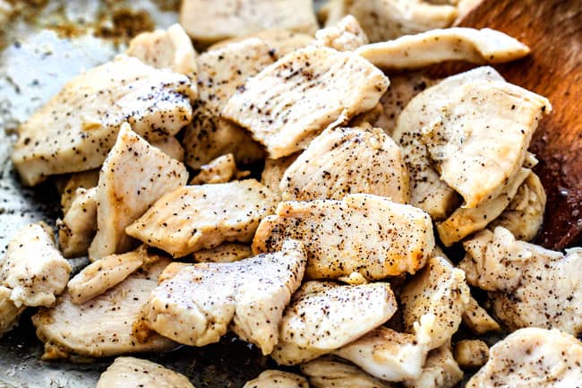 showing how to make Chicken Stroganoff by cooking thinly sliced chicken and seasoning with salt and pepper