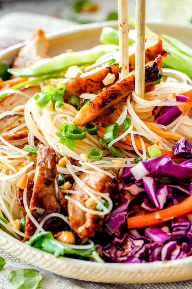 up close of chopsticks picking up Vietnamese Noodles