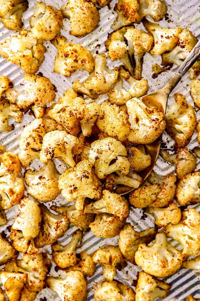 top view of curry roasted cauliflower on a baking sheet
