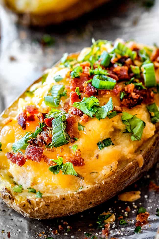 up close side view of twice baked potatoes with sour creraem