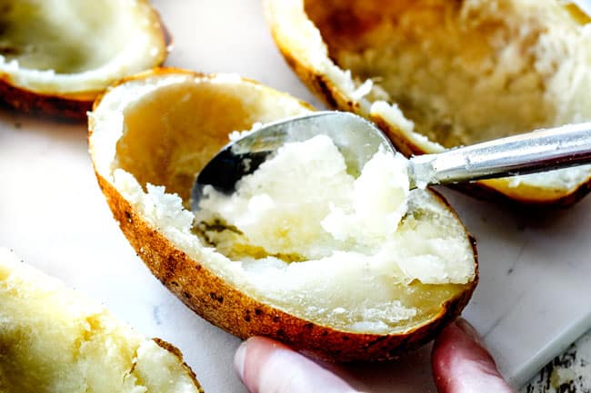 showing how to make twice baked potatoes by scooping out potato flesh