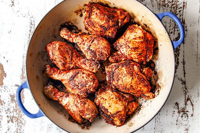 showing how to make Arroz con Pollo by searing chicken until golden