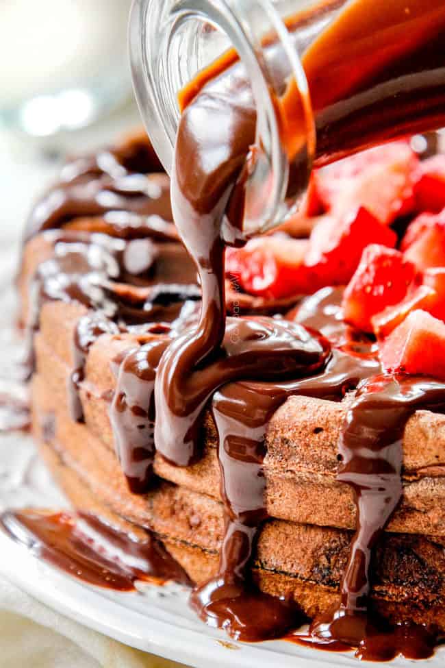 pouring chocolate ganache over waffles like chocolate syrup