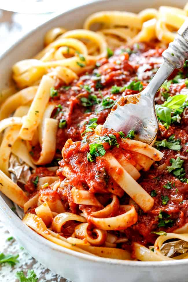 a forkful of noodles with the best Marinara Sauce