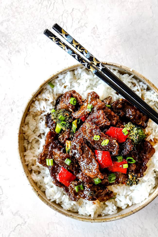 far away top view of authentic Mongolian Beef recipe in a bowl with black chopsticks