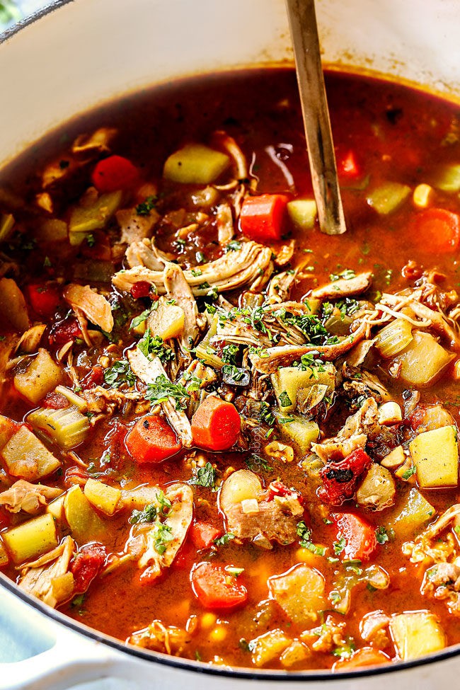 up close of a whitte pot of Caldo de Pollo (Mexican Chicken Soup)