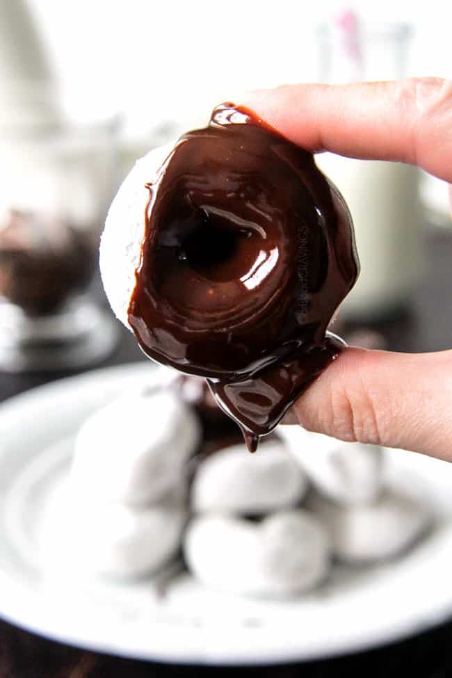 5 Minute Fool Proof Chocolate Ganache (sauce) is silky, creamy, sweet and 1,000 TIMES BETTER than any store bought chocolate sauce. Perfect for brownies, ice cream, cakes, popcorn, strawberries, etc up close of chocolate ganache glaze over a donut