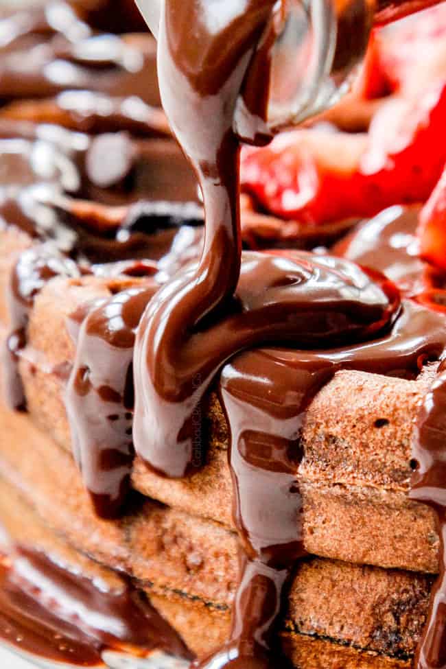 up close of pouring chocolate syrup over hershey chocolate waffles