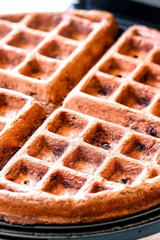 showing how to make chocolate waffles by baking waffles in waffle iron