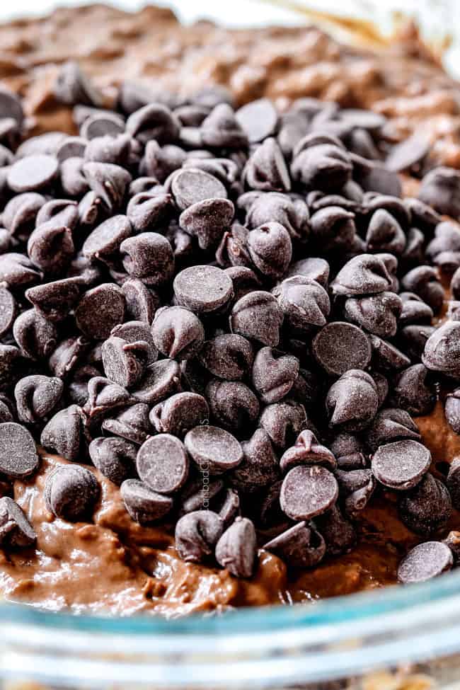 showing how to make Chocolate Waffles by adding chocolate chips into waffle batter