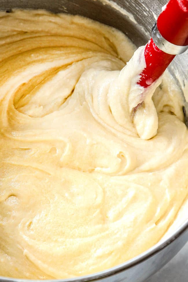 showing how to make Kentucky Butter Cake by mixing dry ingredients with wet ingredients