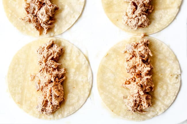 showing how to make enchiladas verdes by adding chicken to the center of corn tortillas