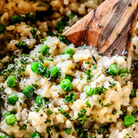 showing how to make risotto by stirring cooked risotto rice