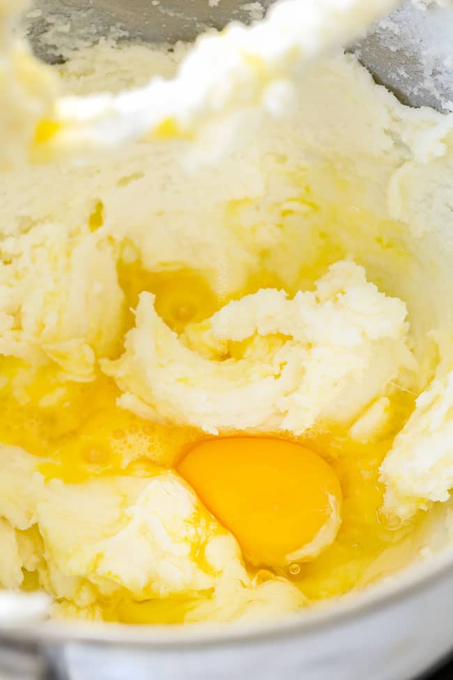 showing how to make banana cake by mixing eggs into batter