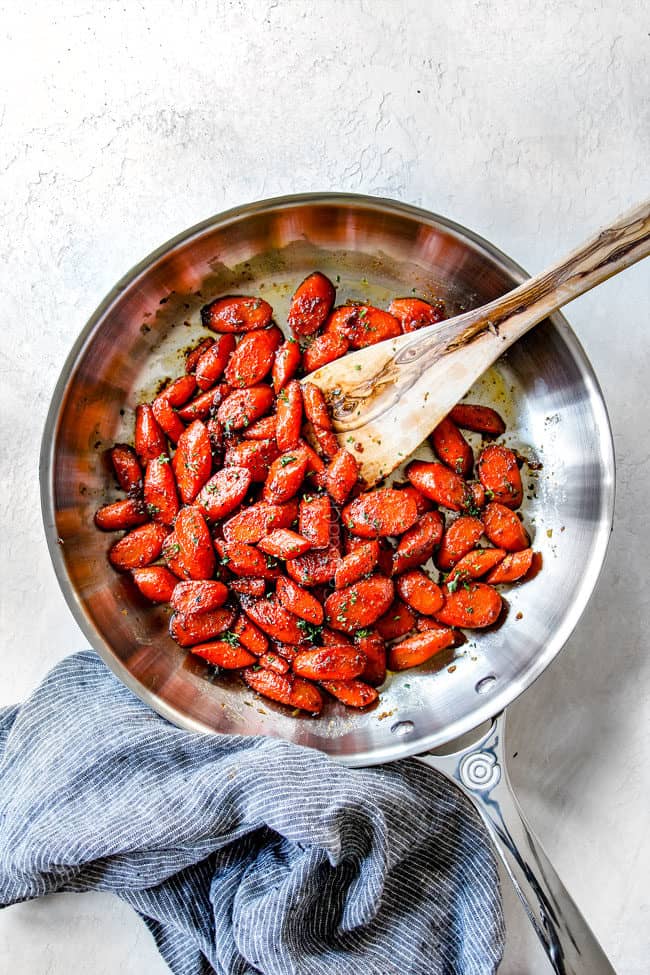 far away view of top view of maple glazed carrots recipe in a skillet