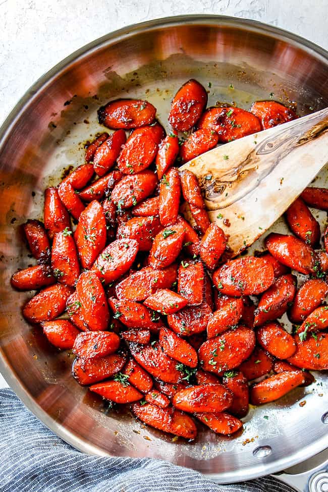 showing how to make brown sugar glazed carrots recipe by cooking carrots in a stainless steel skillet