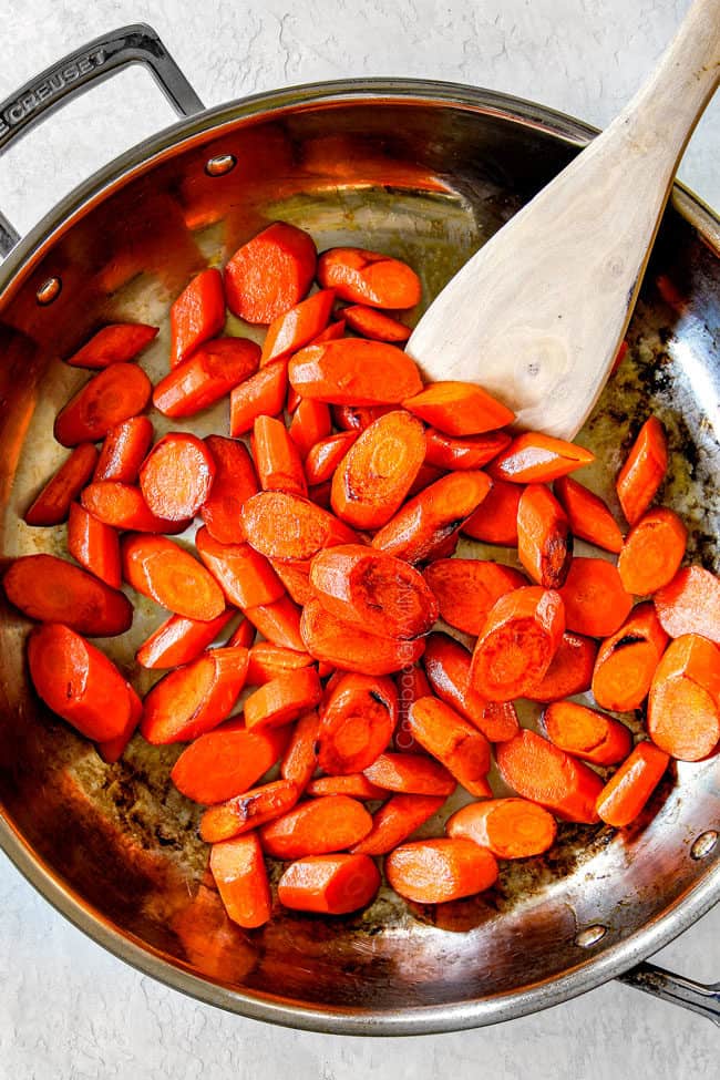 showing how to make candied carrots by cooking carrots in a skillet