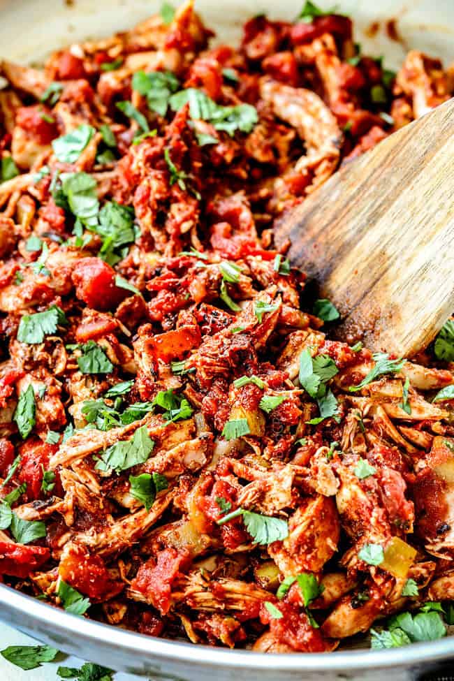 up close of authentic Mexican Chicken in a skillet with cilantro