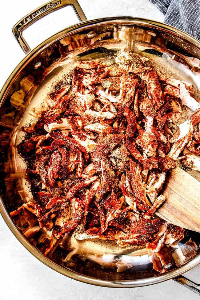 showing how to make Mexican Chicken by adding seasonings to chicken in a skillet