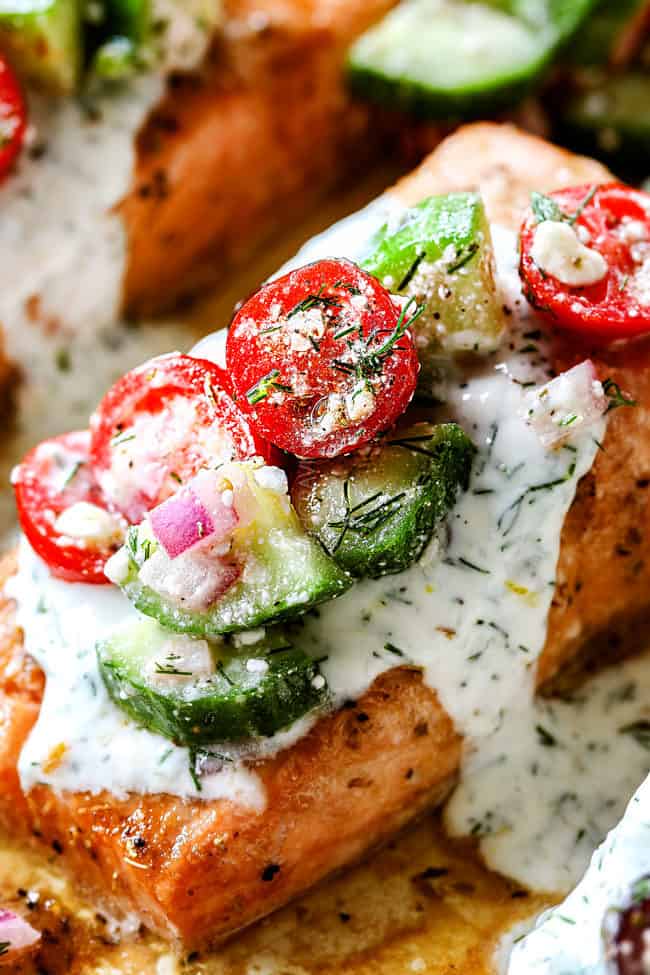 up close of oven baked salmon with dill sauce