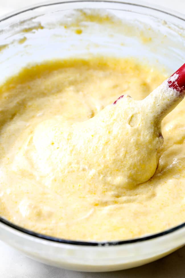 showing how to make strawberry shortcake cake by stirring batter