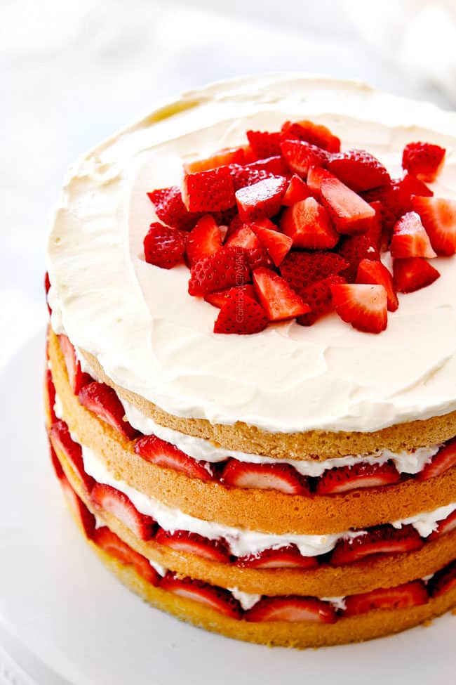 top view of strawberry shortcake cake with fresh strawberries