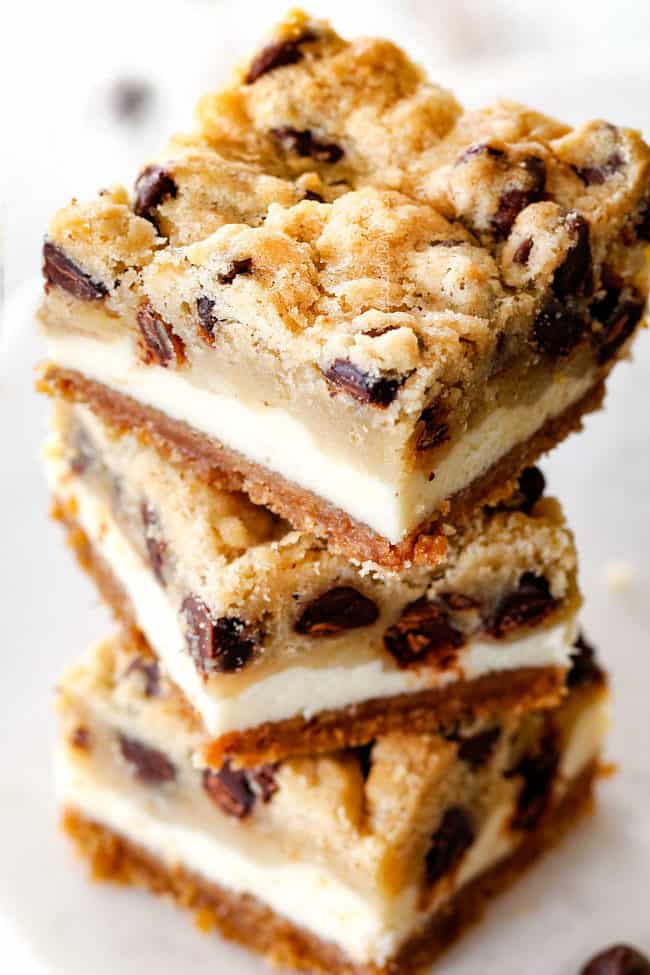stack of Chocolate Chip Cheesecake Bars with homemade cookie dough