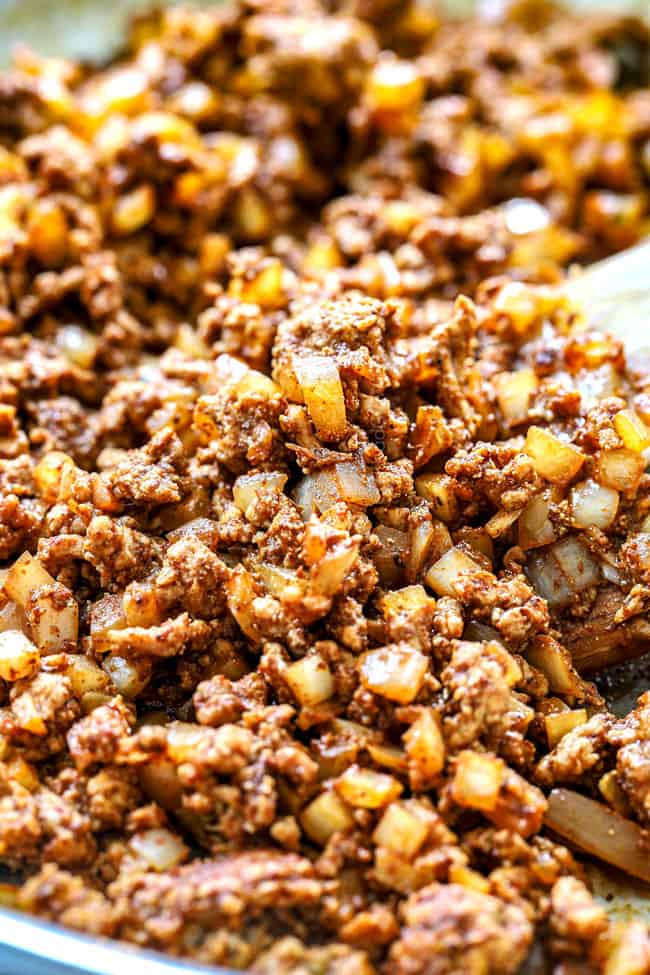 showing how to make e stuffed avocados by browning turkey and onions