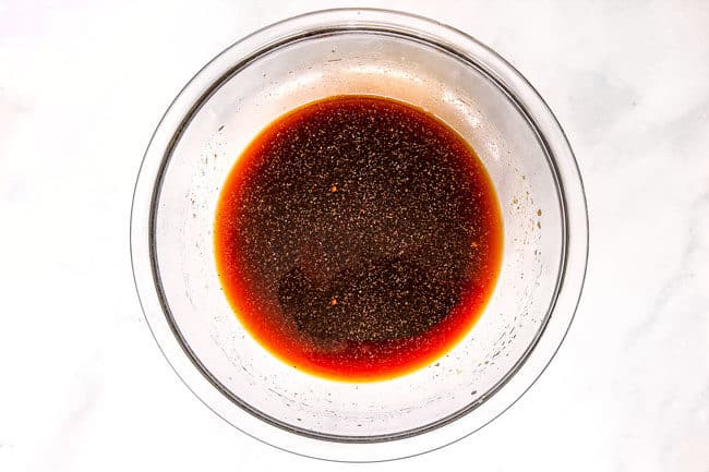 showing how to make yakitori by whisking together yakitori sauce