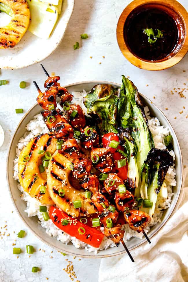 top view of a bowl of grilled momo yakitori recipe with rice and yakitori sauce