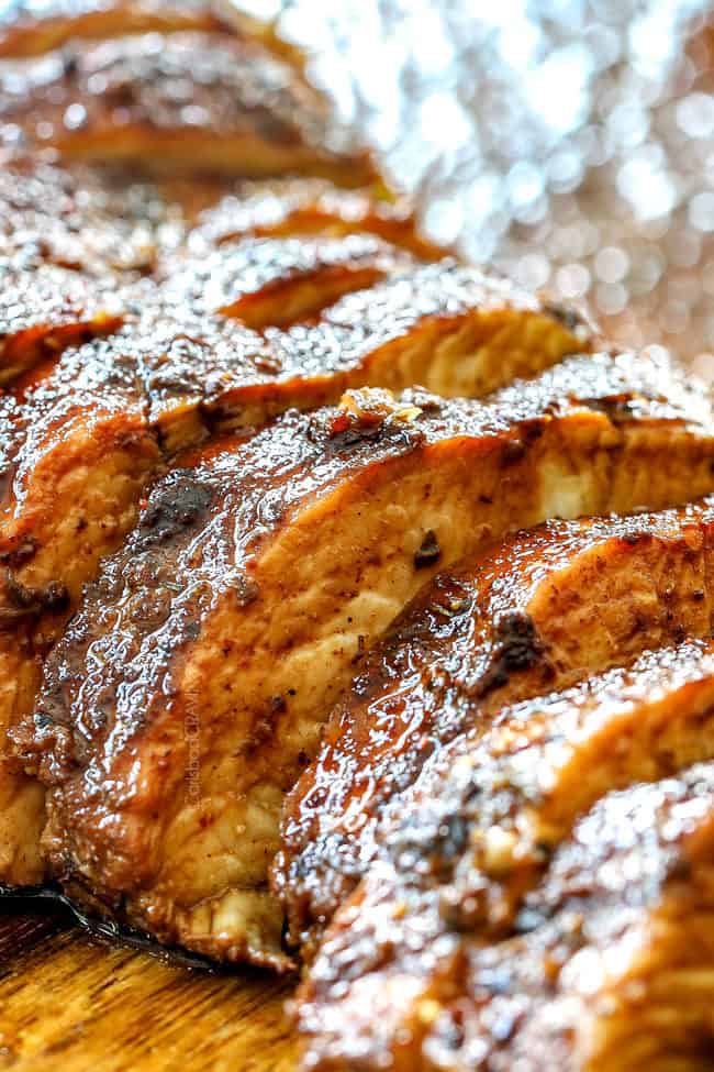 showing how to make chicken gyro recipe by slicing Greek Chicken