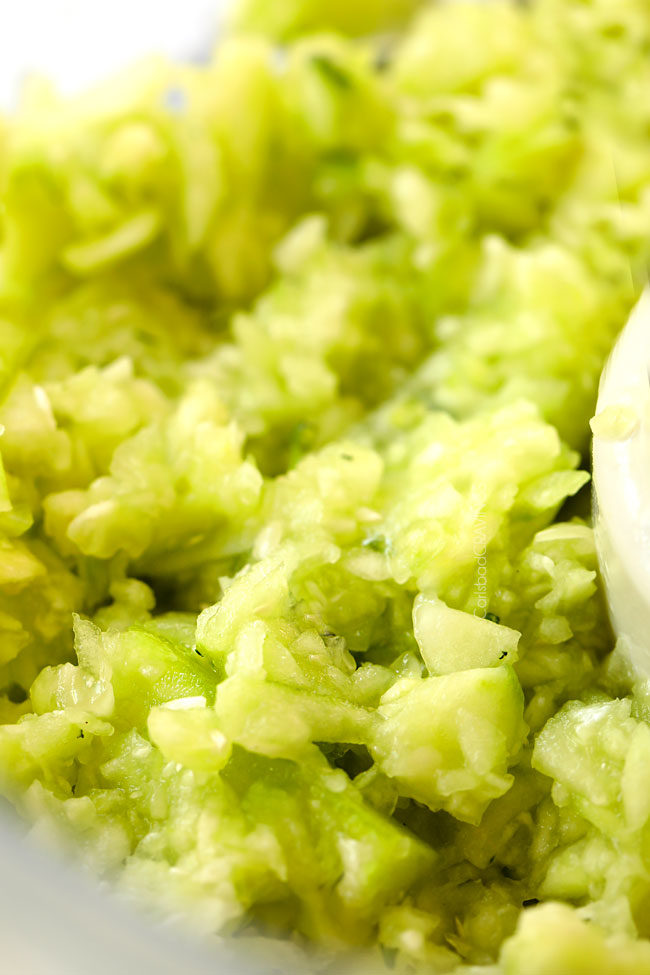 showing how to make Tzatziki by chopping cucumbers in food processor