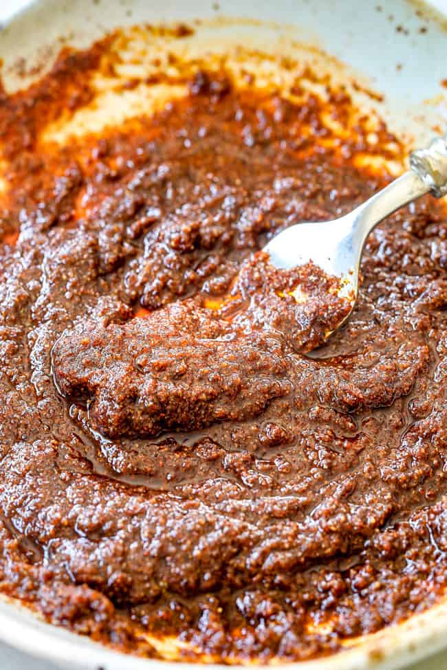 showing how to grill pork tenderloin by whisking together grilled pork tenderloin rub ingredients