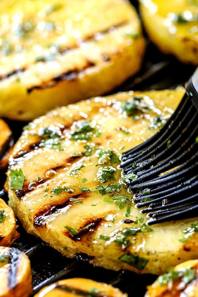 howing how to make salmon bowls by brushing pineapple with marinade