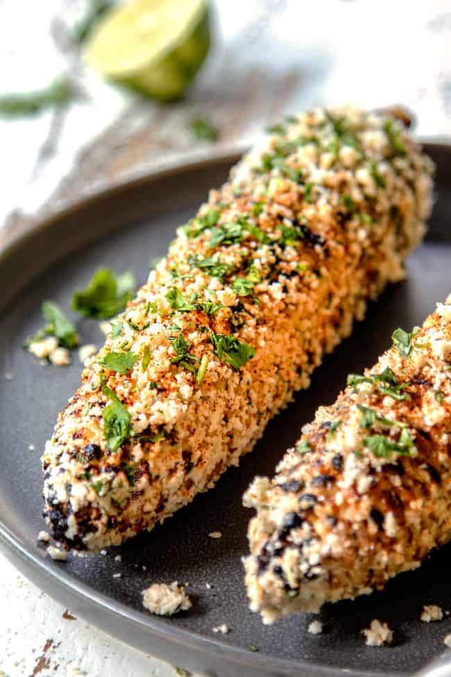 up close of elote Mexicano on a gray plate