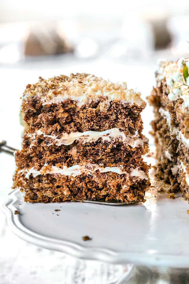 a slice of best hummingbird cake recipe being served from cake platter