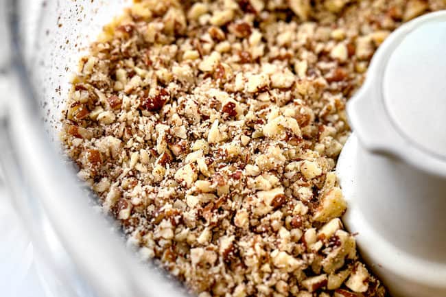 showing how to make hummingbird cake by chopping pecans