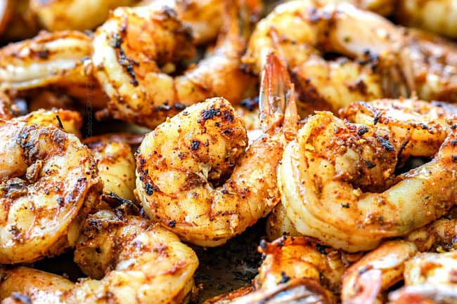 showing how to make stuffed zucchini boats by cooking shrimp